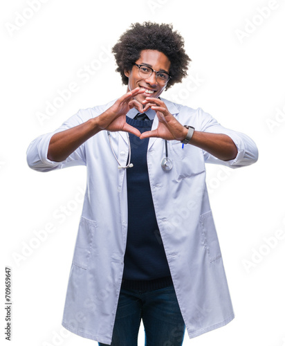 Afro american doctor man over isolated background smiling in love showing heart symbol and shape with hands. Romantic concept.