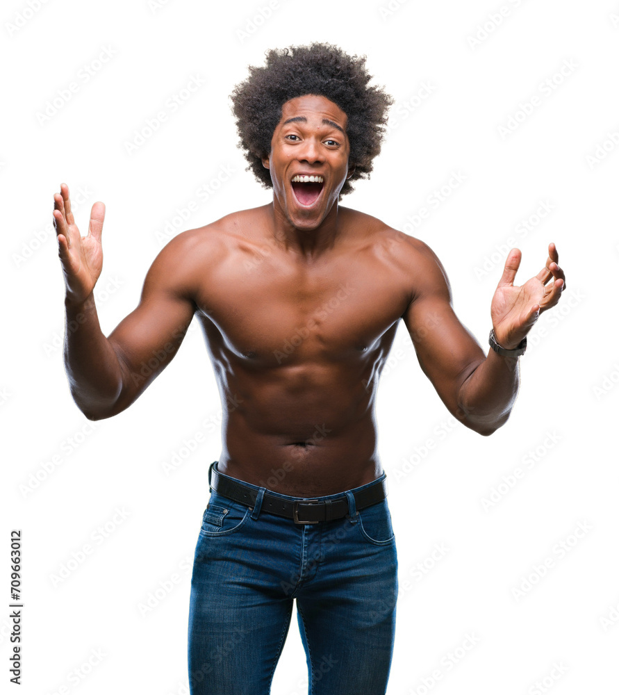 Afro american shirtless man showing nude body over isolated background celebrating crazy and amazed for success with arms raised and open eyes screaming excited. Winner concept Afro american shirtless man showing nude body over isolated background celebrating crazy and amazed for success with arms raised and open eyes screaming excited. Winner concept