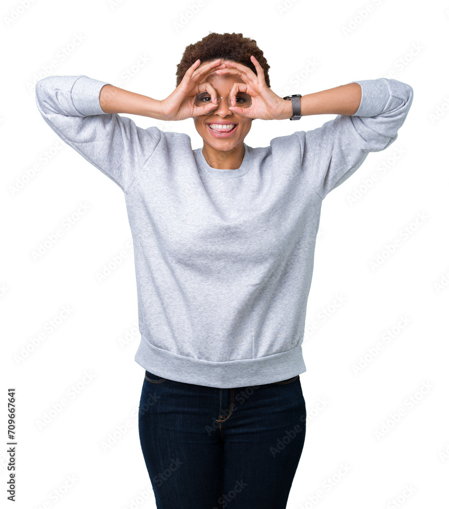 Young beautiful african american woman wearing glasses over isolated background doing ok gesture like binoculars sticking tongue out, eyes looking through fingers. Crazy expression. Young beautiful african american woman wearing glasses over isolated background doing ok gesture like binoculars sticking tongue out, eyes looking through fingers. Crazy expression.