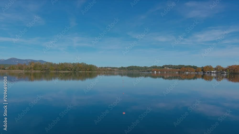 Lanes delimited with buoys in Lake Banyoles to practice rowing sports Lanes delimited with buoys in Lake Banyoles to practice rowing sports