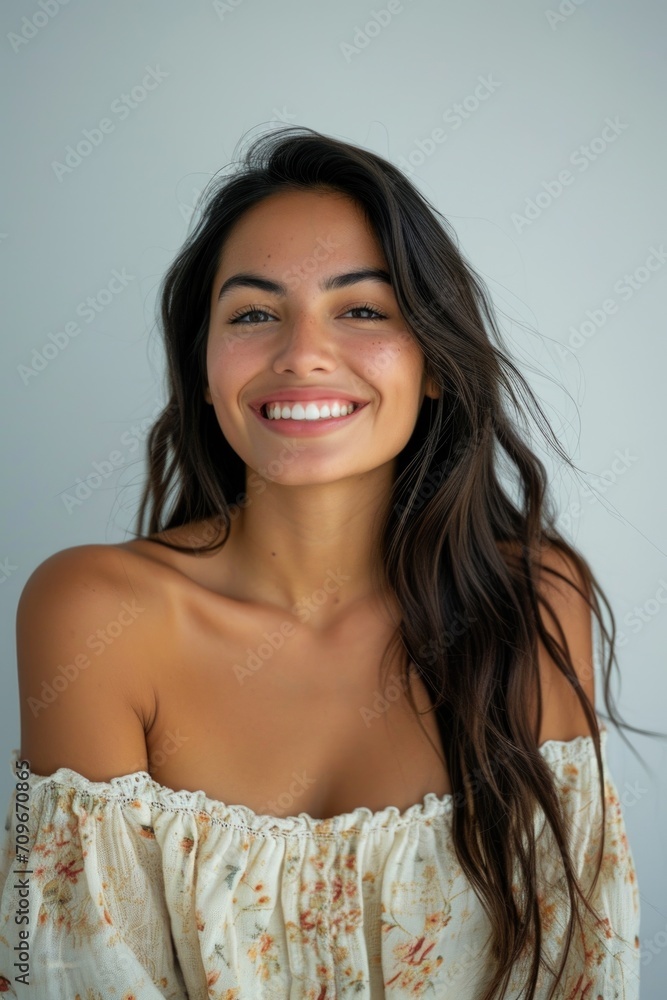 A woman with long brown hair smiling at the camera. Perfect for advertisements, lifestyle blogs, and beauty-related content A woman with long brown hair smiling at the camera. Perfect for advertisements, lifestyle blogs, and beauty-related content