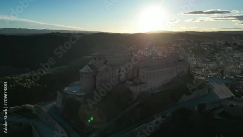 Cardona Castle and San Vicente Church at sunrise with Sun Lens flares photo