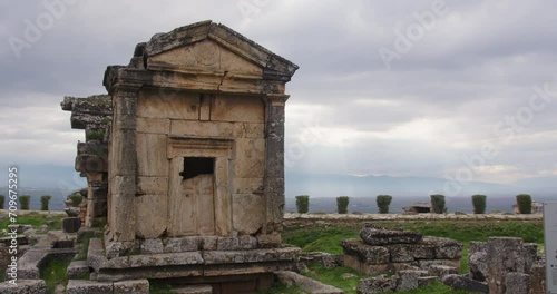 Wide shot of Tomb A18 and the cloudy sky in the ancient Necropolis of Hierapolis. photo