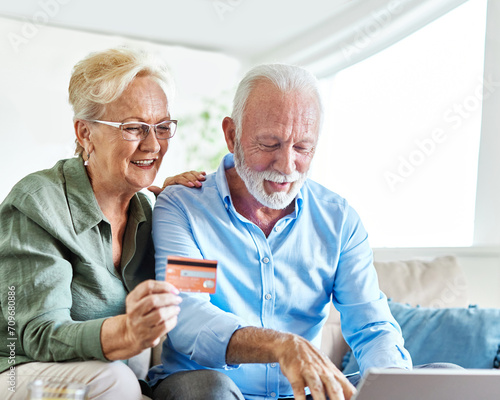 couple credit woman laptop shopping card online senior elderly retirement adult old retired mature senior couple pensioner older active two aged vitality online shopping finace buying bill photo