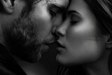 A romantic black and white image capturing a passionate kiss between a man and a woman. Perfect for expressing love and affection.