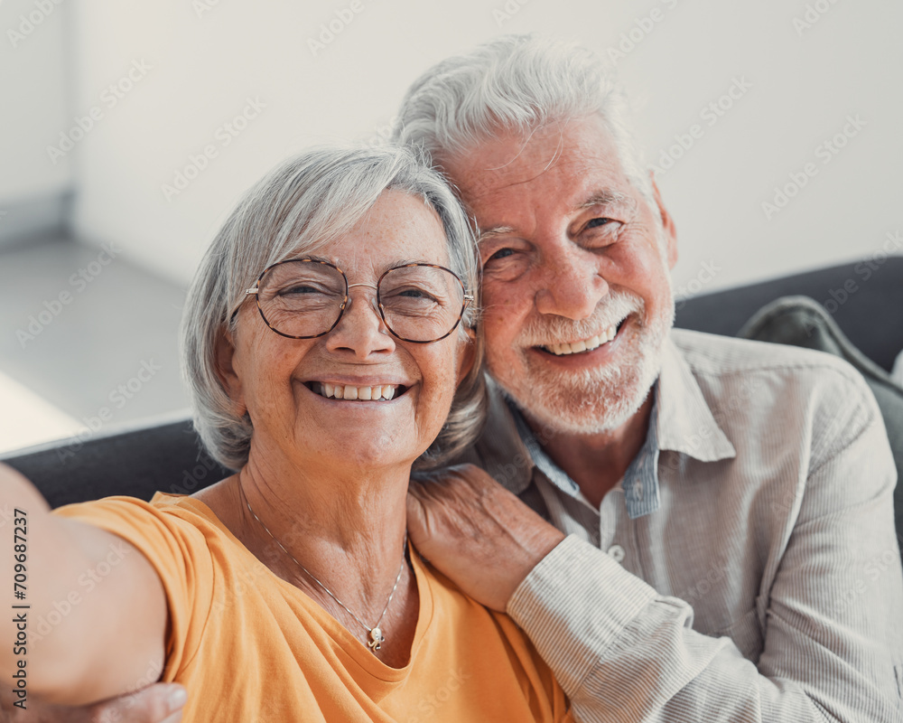 Head shot portrait happy senior couple taking selfie, having fun with phone cam, smiling aged wife and husband hugging, looking at camera, posing for photo, aged man vlogger recording video. Head shot portrait happy senior couple taking selfie, having fun with phone cam, smiling aged wife and husband hugging, looking at camera, posing for photo, aged man vlogger recording video.