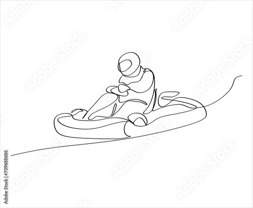 Competitive person having fun on go kart track. Go kart track and driver for car racing to have fun in the city.