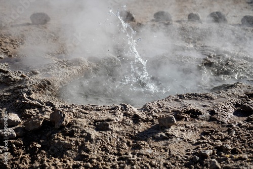 Hot water erupting from a geyser frozen in time. Geysers Del Tatio, Antofagasta, Chile. 