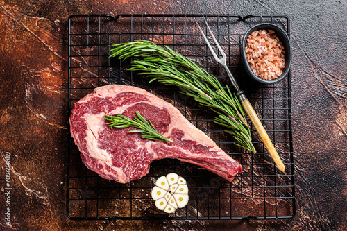 Obraz na plátně Raw uncooked dry aged beef  tomahawk or rib eye steak