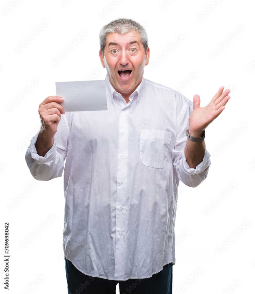 Handsome senior man holding blank card over isolated background very happy and excited, winner expression celebrating victory screaming with big smile and raised hands Handsome senior man holding blank card over isolated background very happy and excited, winner expression celebrating victory screaming with big smile and raised hands