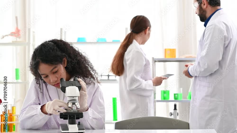 4K Research teams in health sciences at laboratory while working together 4K Research teams in health sciences at laboratory while working together