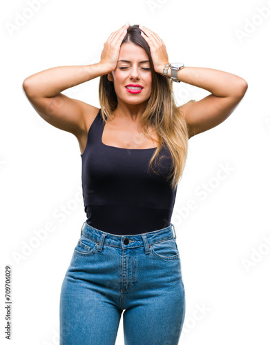 Young beautiful woman over isolated background suffering from headache desperate and stressed because pain and migraine. Hands on head.