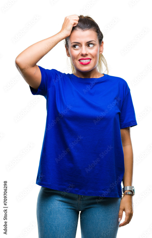 Young beautiful woman wearing casual blue t-shirt over isolated background confuse and wonder about question. Uncertain with doubt, thinking with hand on head. Pensive concept. Young beautiful woman wearing casual blue t-shirt over isolated background confuse and wonder about question. Uncertain with doubt, thinking with hand on head. Pensive concept.