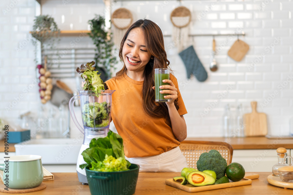 Portrait of beauty healthy asian woman making green vegetables detox cleanse and green fruit smoothie with blender.young girl drinking glass of smoothie, fiber, chlorophyll in kitchen.Diet, healthy - obrazy, fototapety, plakaty 