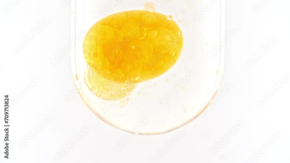 Gold Serum Drops, Water Drops. Transparency Liquid Element. Cosmetics Serum Liquid Bubbles. Collagen Fluid Bubble Molecule, Essence Gel. Skincare, Beauty, Cosmetic. Macro Shot. FullHD Gold Serum Drops, Water Drops. Transparency Liquid Element. Cosmetics Serum Liquid Bubbles. Collagen Fluid Bubble Molecule, Essence Gel. Skincare, Beauty, Cosmetic. Macro Shot. FullHD