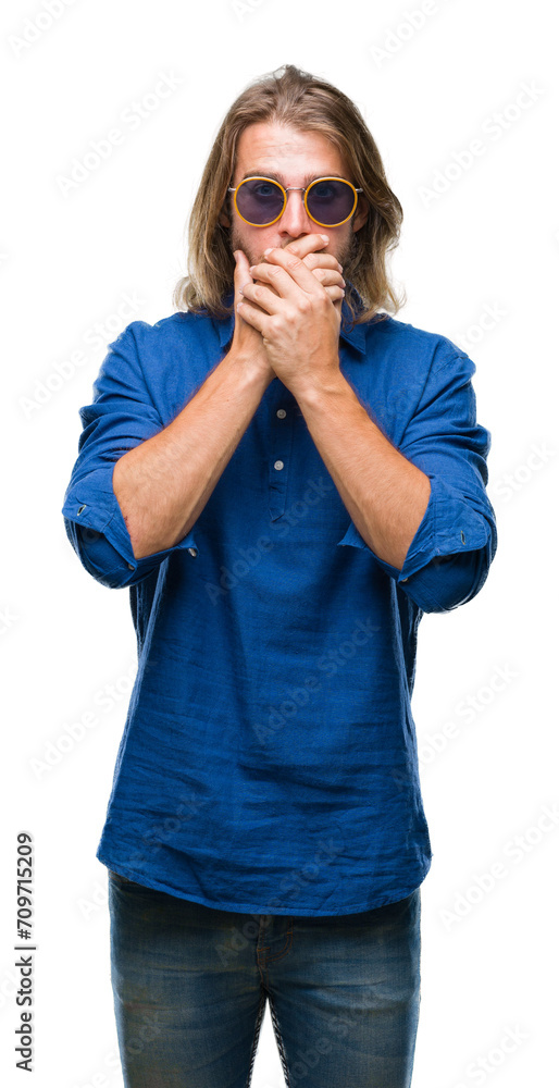 Young handsome man with long hair wearing sunglasses over isolated background shocked covering mouth with hands for mistake. Secret concept. Young handsome man with long hair wearing sunglasses over isolated background shocked covering mouth with hands for mistake. Secret concept.