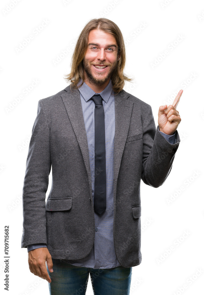 Young handsome business man with long hair over isolated background with a big smile on face, pointing with hand and finger to the side looking at the camera. Young handsome business man with long hair over isolated background with a big smile on face, pointing with hand and finger to the side looking at the camera.