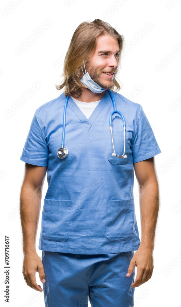 Young handsome doctor man with long hair over isolated background looking away to side with smile on face, natural expression. Laughing confident. Young handsome doctor man with long hair over isolated background looking away to side with smile on face, natural expression. Laughing confident.