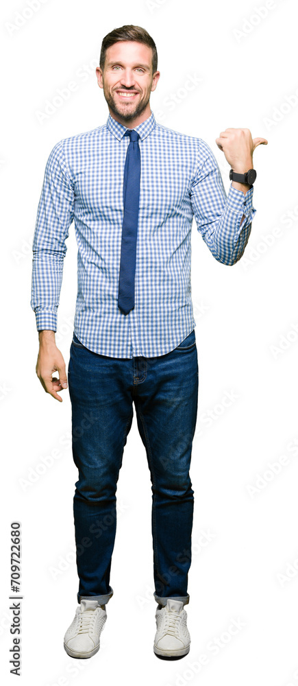 Handsome business man wearing tie smiling with happy face looking and pointing to the side with thumb up. Handsome business man wearing tie smiling with happy face looking and pointing to the side with thumb up.