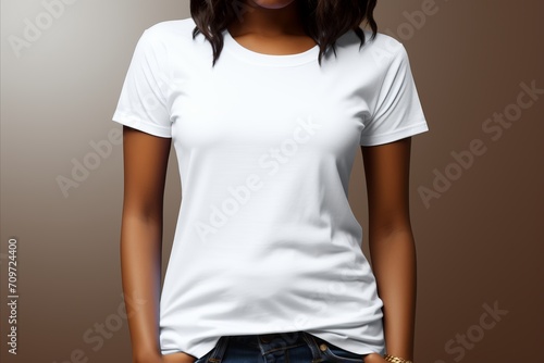 Portrait of a woman in a white t-shirt against a plain background, focusing on the product