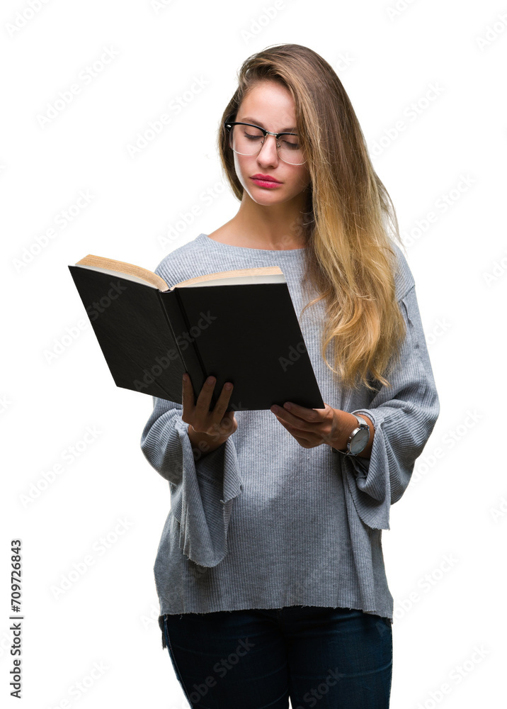 Young beautiful blonde woman reading a book over isolated background with a confident expression on smart face thinking serious Young beautiful blonde woman reading a book over isolated background with a confident expression on smart face thinking serious