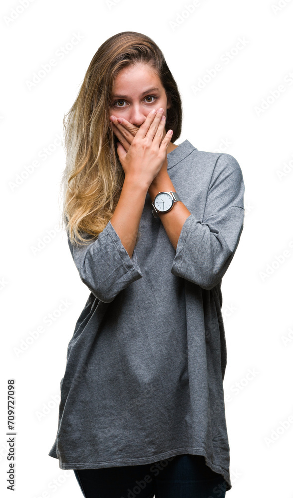 Young beautiful blonde woman over isolated background shocked covering mouth with hands for mistake. Secret concept. Young beautiful blonde woman over isolated background shocked covering mouth with hands for mistake. Secret concept.