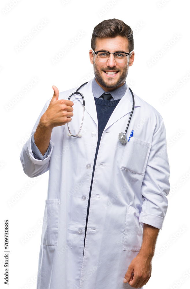 Young handsome doctor man over isolated background doing happy thumbs up gesture with hand. Approving expression looking at the camera with showing success. Young handsome doctor man over isolated background doing happy thumbs up gesture with hand. Approving expression looking at the camera with showing success.