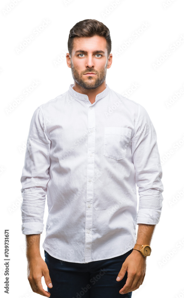 Young handsome man over isolated background with serious expression on face. Simple and natural looking at the camera. Young handsome man over isolated background with serious expression on face. Simple and natural looking at the camera.
