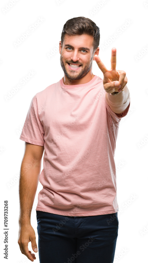 Young handsome man over isolated background smiling looking to the camera showing fingers doing victory sign. Number two. Young handsome man over isolated background smiling looking to the camera showing fingers doing victory sign. Number two.