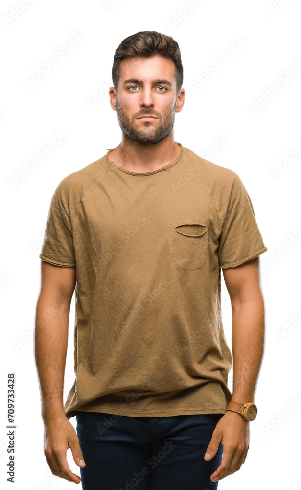 Young handsome man over isolated background with serious expression on face. Simple and natural looking at the camera. Young handsome man over isolated background with serious expression on face. Simple and natural looking at the camera.