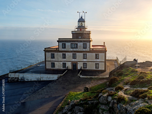 Finisterre Cape Lighthouse, Costa da Morte, Galicia, Spain. One of the most famous Lighthouse in Western Europe. Last stage in the Camino de Santiago. photo