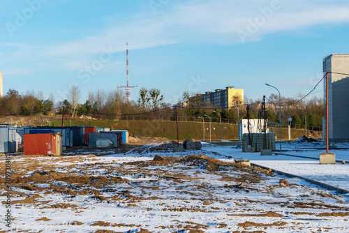 Mobile metal containers for the placement of a work crew on a construction site in winter. A temporary residential town of builders. A simple heated building to accommodate workers