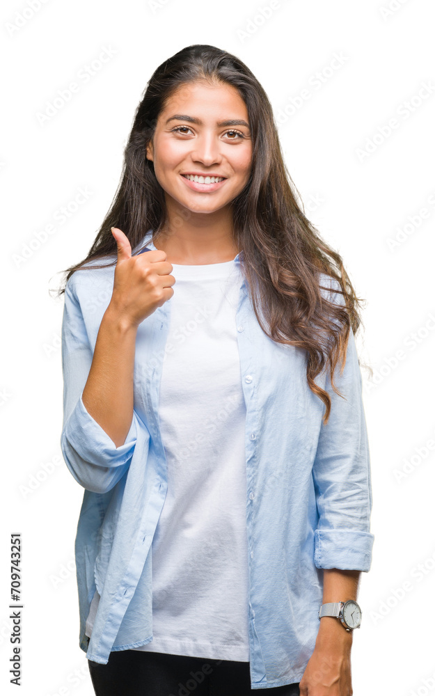 Young beautiful arab woman over isolated background doing happy thumbs up gesture with hand. Approving expression looking at the camera with showing success. Young beautiful arab woman over isolated background doing happy thumbs up gesture with hand. Approving expression looking at the camera with showing success.