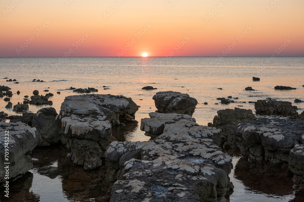 Fototapeta premium Rocks on sea in sunset