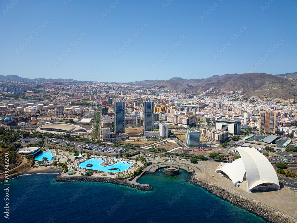 Aerial view of Santa Cruz de Tenerife, in the Canary Islands, Spain. Resorts and pools next to the Atlantic ocean. Famous tourist destinations. Island in the Atlantic ocean.