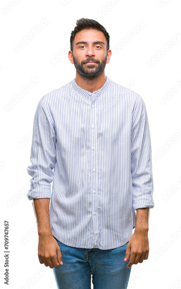 Adult hispanic man over isolated background with serious expression on face. Simple and natural looking at the camera. Adult hispanic man over isolated background with serious expression on face. Simple and natural looking at the camera.