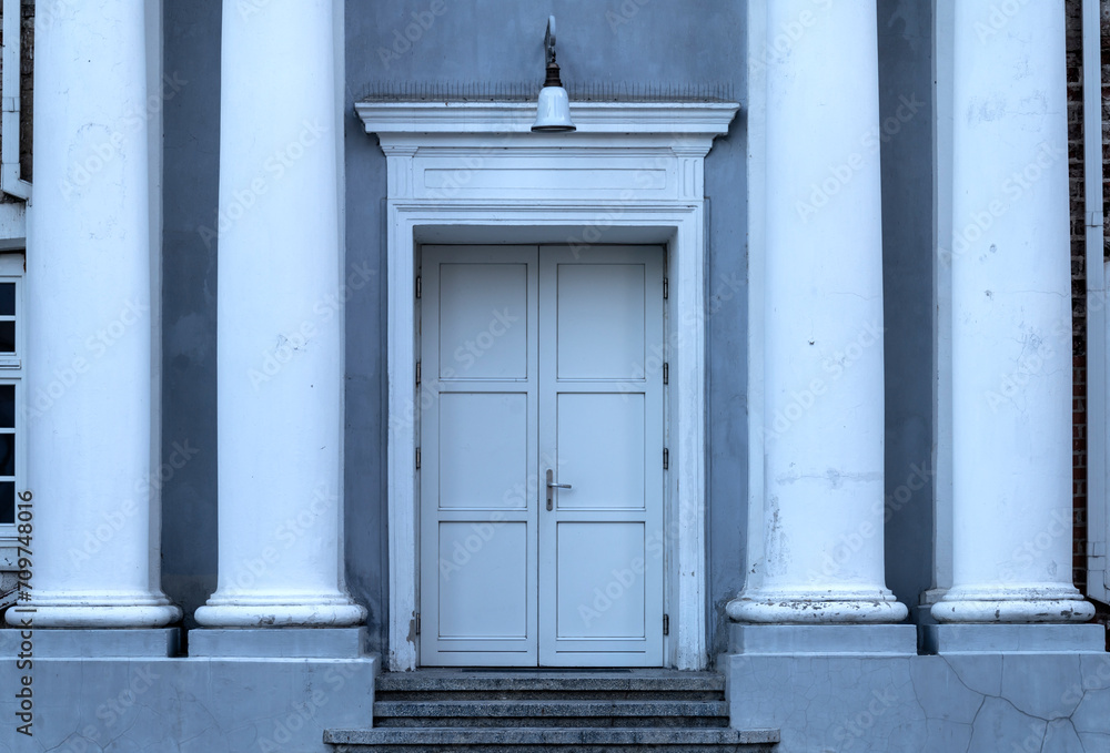 Classical White Double Doors Between Elegant Columns