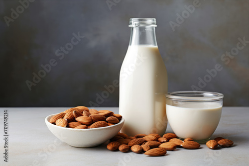 Organic almond milk and raw almonds for cooking.