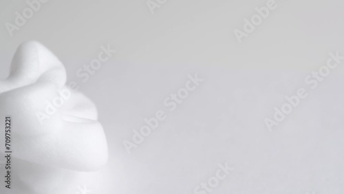 Hair foam mousse, macro. Beauty background. Close up of white cloud of hair mousse or shaving foam. photo
