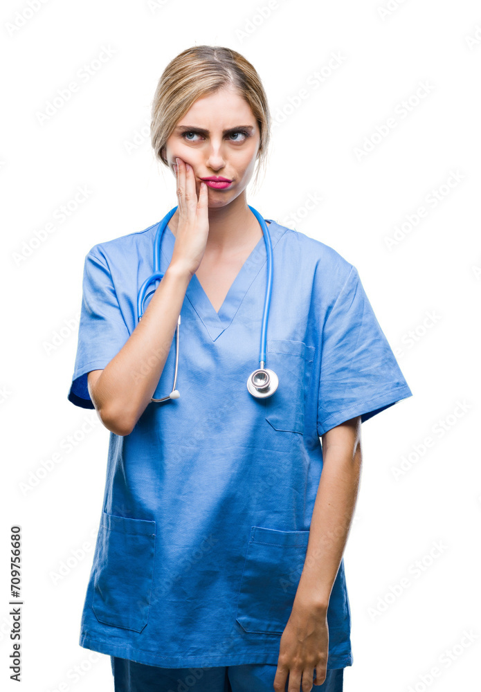 Young beautiful blonde doctor surgeon nurse woman over isolated background thinking looking tired and bored with depression problems with crossed arms. Young beautiful blonde doctor surgeon nurse woman over isolated background thinking looking tired and bored with depression problems with crossed arms.