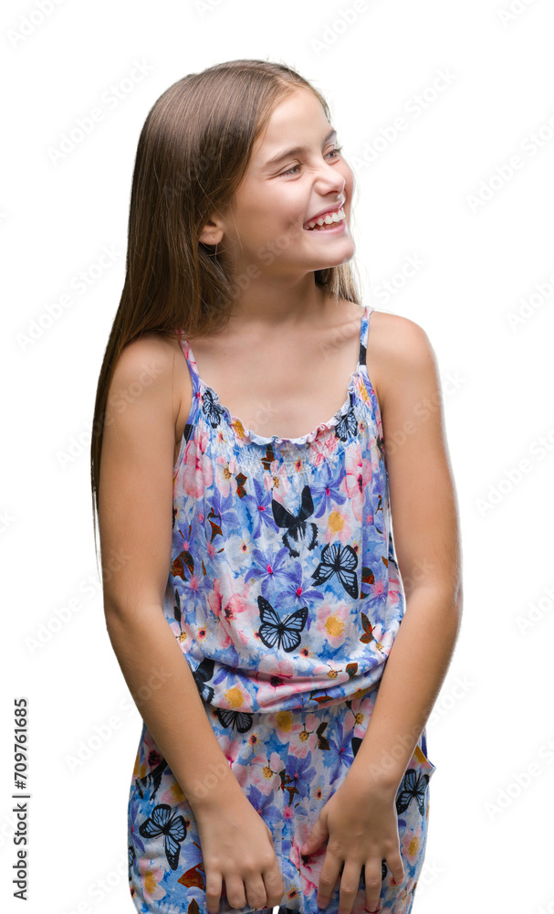 Young beautiful girl wearing colorful dress over isolated background looking away to side with smile on face, natural expression. Laughing confident. Young beautiful girl wearing colorful dress over isolated background looking away to side with smile on face, natural expression. Laughing confident.