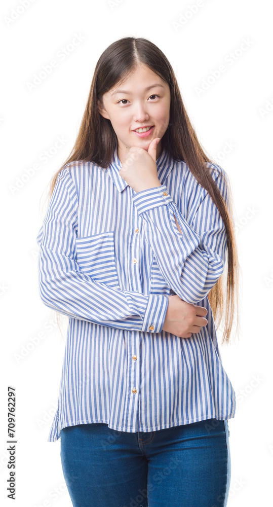 Young Chinese woman over isolated background looking confident at the camera with smile with crossed arms and hand raised on chin. Thinking positive. Young Chinese woman over isolated background looking confident at the camera with smile with crossed arms and hand raised on chin. Thinking positive.