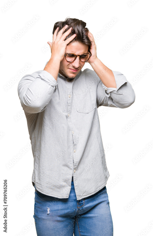 Young handsome man wearing glasses over isolated background suffering from headache desperate and stressed because pain and migraine. Hands on head. Young handsome man wearing glasses over isolated background suffering from headache desperate and stressed because pain and migraine. Hands on head.