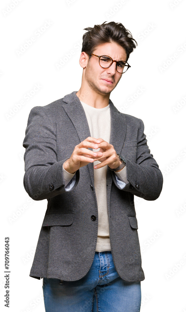 Young business man wearing glasses over isolated background disgusted expression, displeased and fearful doing disgust face because aversion reaction. With hands raised. Annoying concept. Young business man wearing glasses over isolated background disgusted expression, displeased and fearful doing disgust face because aversion reaction. With hands raised. Annoying concept.