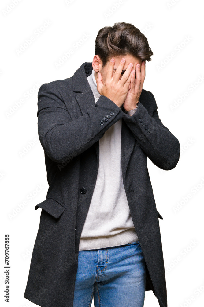 Young elegant man wearing winter coat over isolated background with sad expression covering face with hands while crying. Depression concept. Young elegant man wearing winter coat over isolated background with sad expression covering face with hands while crying. Depression concept.