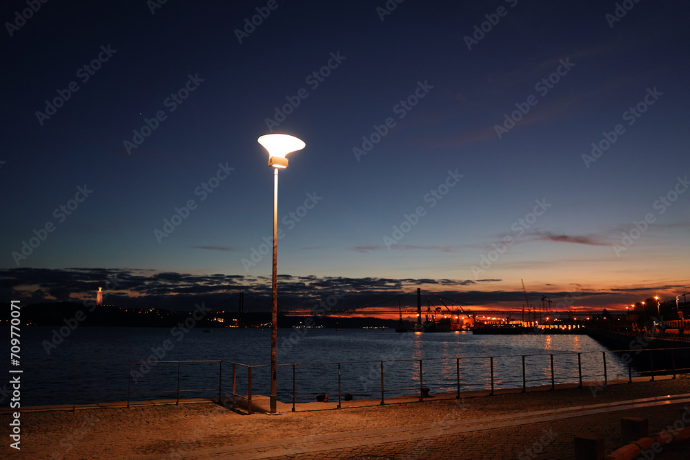 Waterfront promenade in evening time in Lisbon Portugal.