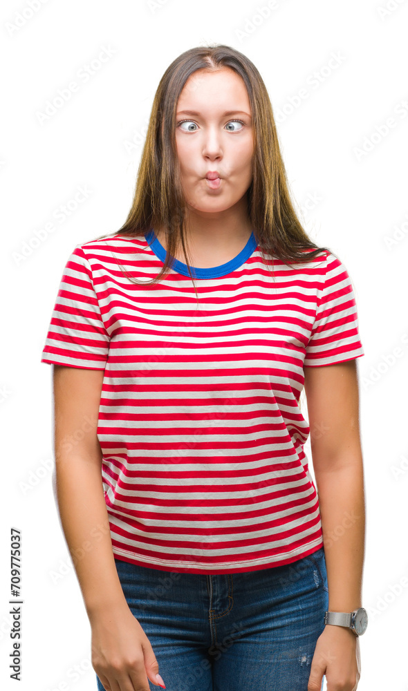 Young caucasian beautiful woman over isolated background making fish face with lips, crazy and comical gesture. Funny expression. Young caucasian beautiful woman over isolated background making fish face with lips, crazy and comical gesture. Funny expression.