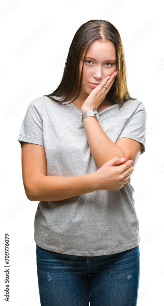 Young caucasian beautiful woman over isolated background thinking looking tired and bored with depression problems with crossed arms. Young caucasian beautiful woman over isolated background thinking looking tired and bored with depression problems with crossed arms.