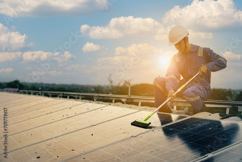 staff cleaning inspect and check solar cell panel by hold equipment box, solar energy, renewable energy,power factory concept, lowkey lighting.