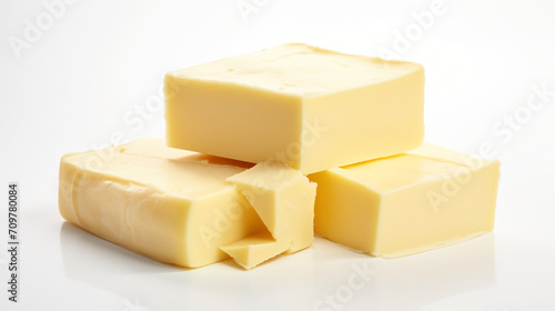Block of fresh butter isolated on white background. photo